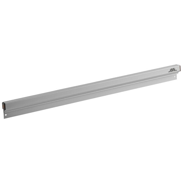 A long metal rectangular wall mounted ticket holder.