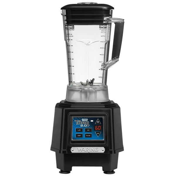 A black and silver Waring commercial blender with a clear container on a counter.