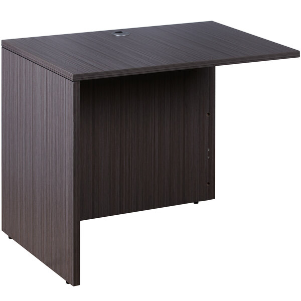 A brown rectangular Boss Driftwood laminate desk with a reversible return.