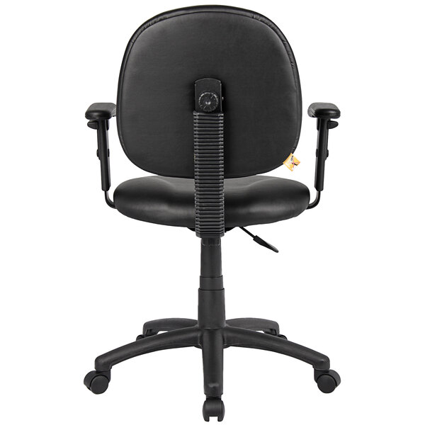 A Boss black Caressoft office chair with wheels and arms.