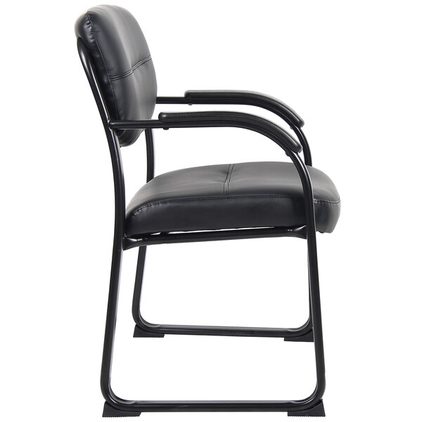 A Boss black leather side chair with metal sled base and armrests.