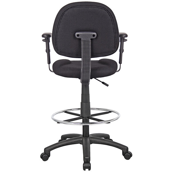 A black Boss drafting stool with a footring and adjustable arms on a metal base.