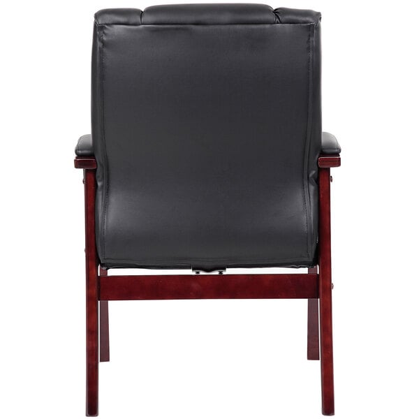 a black chair with wooden legs