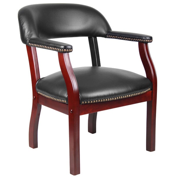 A Boss black vinyl Captain's Chair with studded wood legs.