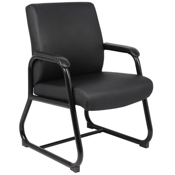 A black Boss heavy duty guest chair with armrests and a black frame.