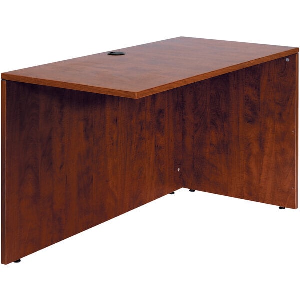 a wooden desk with a black round object on top