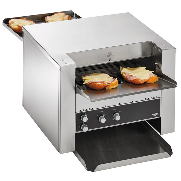 A Vollrath conveyor toaster with a sandwich cooking inside.