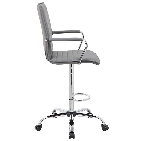 A gray vinyl ribbed drafting stool with chrome base and arms.