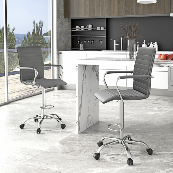 A gray Boss vinyl drafting stool with a metal base.
