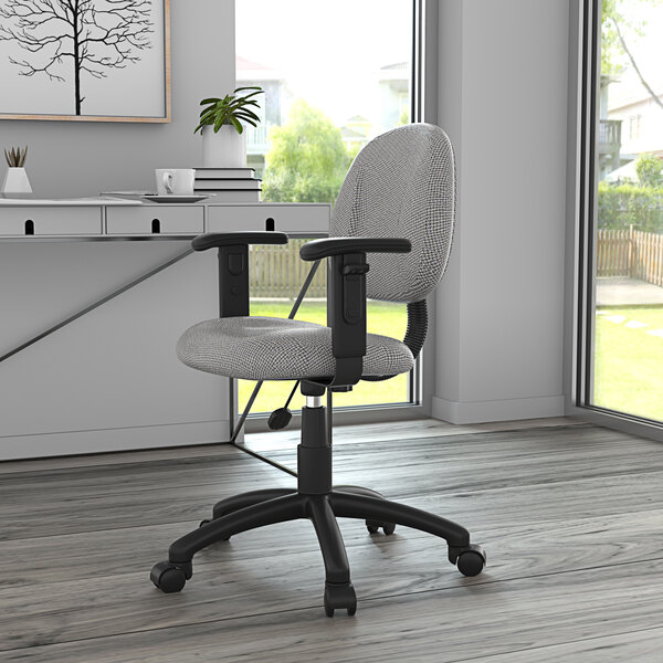 A gray Boss Perfect Posture office chair with wheels and adjustable arms on a black base.