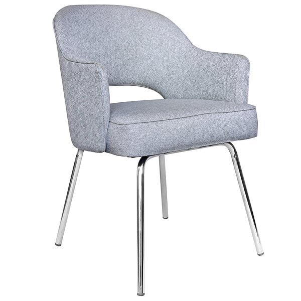 A Boss grey linen guest chair with metal legs.