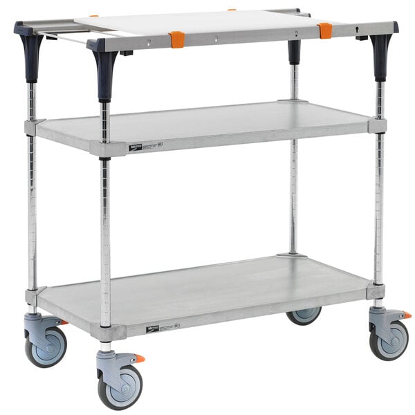 A Metro PrepMate MultiStation, a three tiered metal cart with wheels and a shelf.