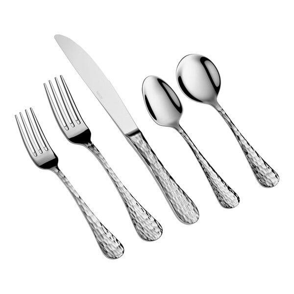 Five pieces of stainless steel flatware with textured handles, including two forks, a knife, and two spoons, arranged side by side on a white background.