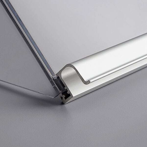 A clear plastic lid cover with a silver metal strip.