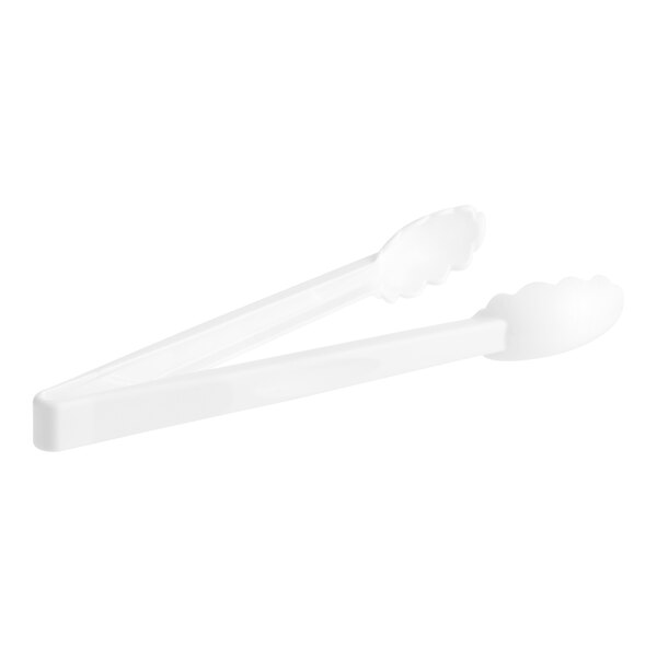 A pair of white plastic tongs with scalloped grips.