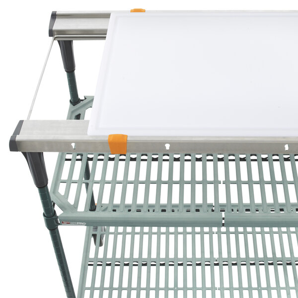 A white cutting board on a Metro metal shelf.