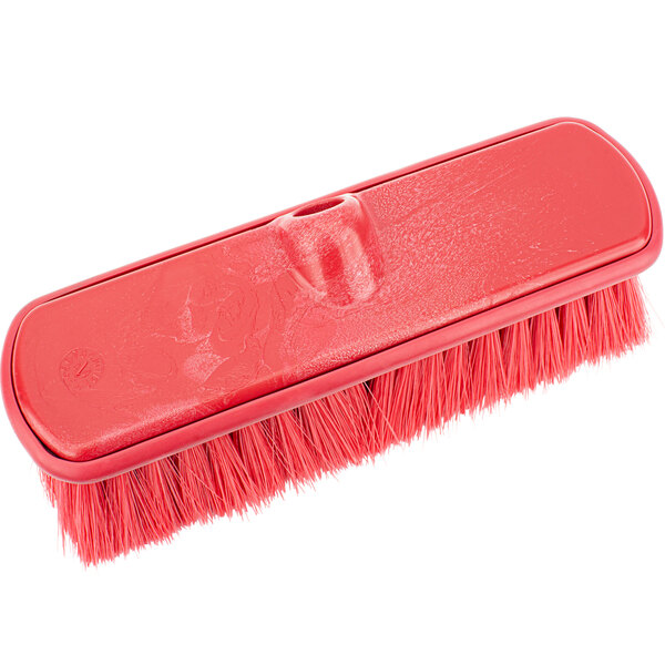 A red Carlisle Sparta brush with a handle.
