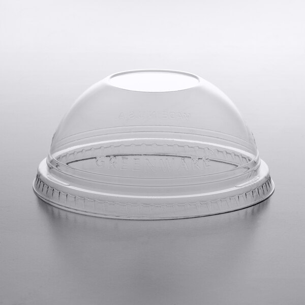 A clear plastic dome lid on a clear plastic cup.