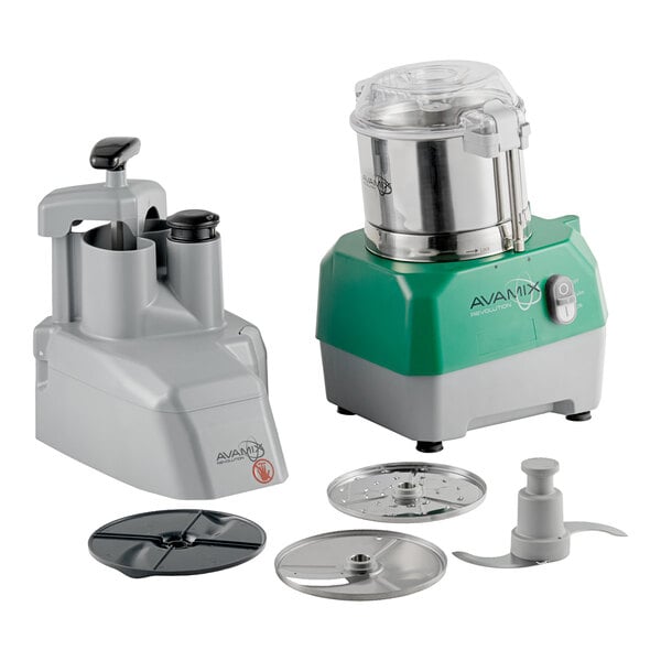 A combination food processor set with a stainless steel bowl, continuous feed attachment, and multiple discs and blades.