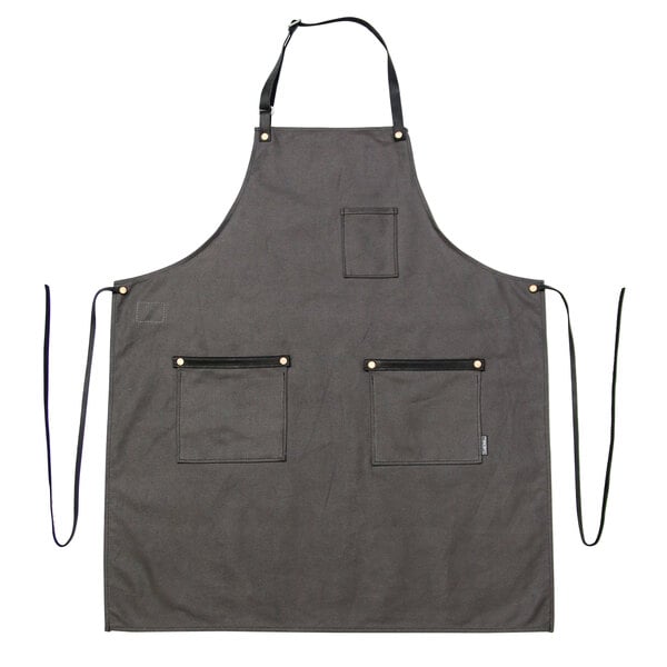 a gray apron with black straps