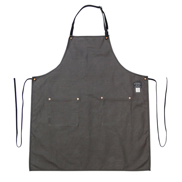 A gray Hardmill Stone canvas apron with black straps and pockets.