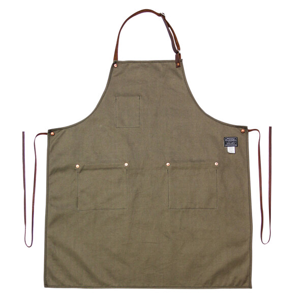 A green Hardmill Moss canvas apron with brown leather straps.