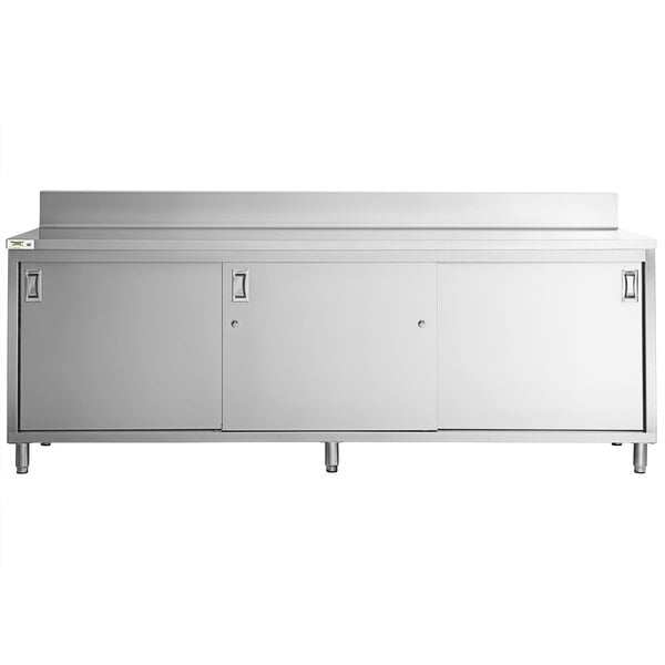 a white cabinet with a white shelf