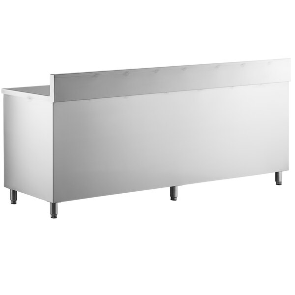 A white rectangular object with a stainless steel frame and legs.