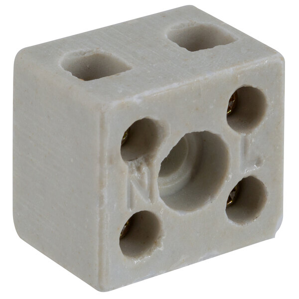 A white square Avantco terminal block with four holes.