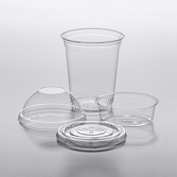 Fabri-Kal Greenware clear plastic parfait cups with inserts and lids.