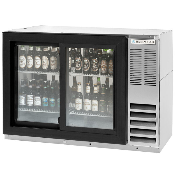 A Beverage-Air back bar refrigerator with beer bottles inside.