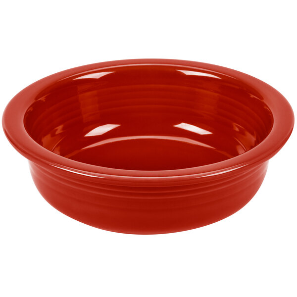 A red Fiesta serving bowl with a white background.