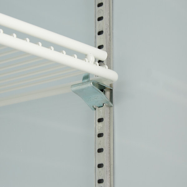 A white shelf with metal brackets and metal rods.