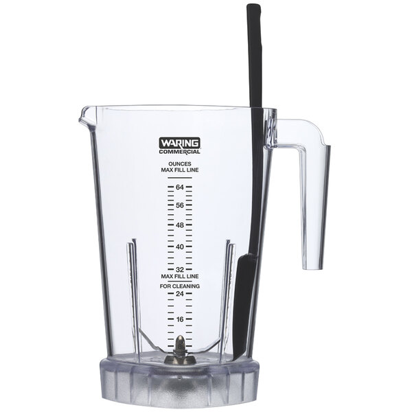 A clear plastic Waring blender with a black handle.