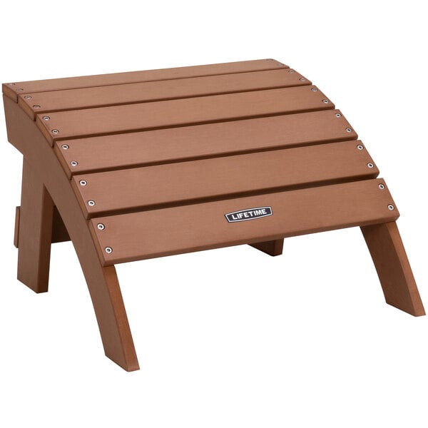 A brown wooden Adirondack ottoman with metal hardware.