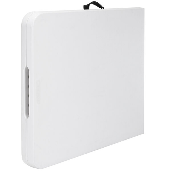 a white rectangular object with a handle