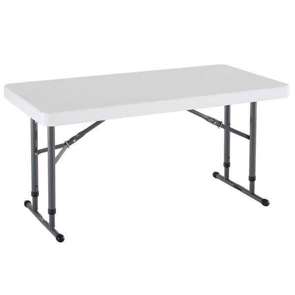 A white rectangular table with metal legs.