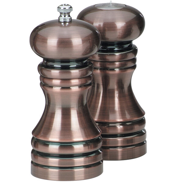 A Chef Specialties burnished copper salt and pepper mill set with silver lids.
