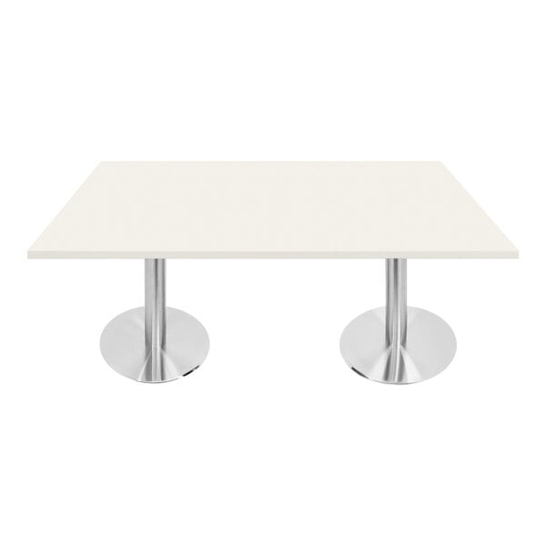 A white rectangular Art Marble Furniture table with silver legs.