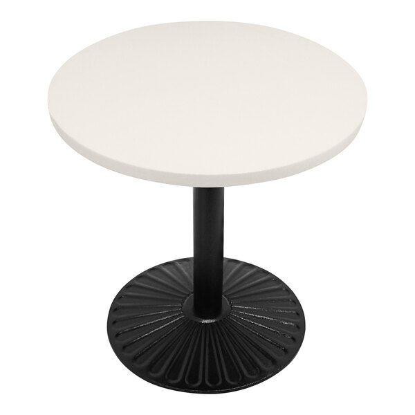 An Art Marble Furniture white circular table top on a black table.