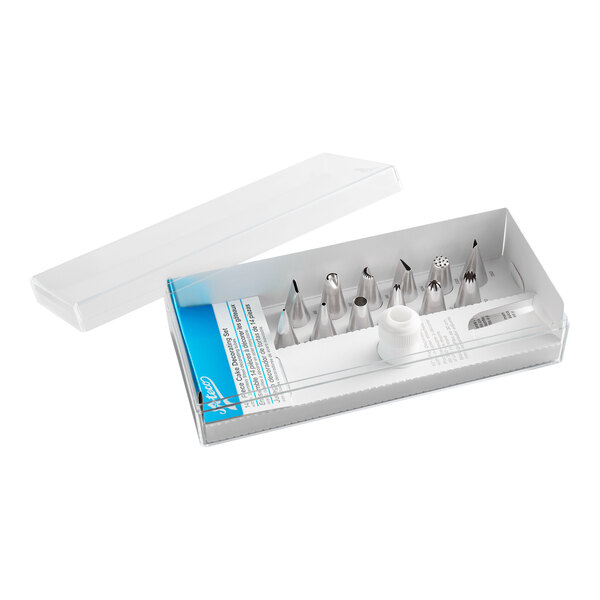 A box containing a set of metal piping tips and a coupler, used for cake decorating.