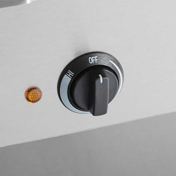 A close up of the dial on a ServIt mobile electric steam table.