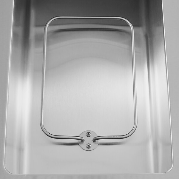 a metal container with a hole in it