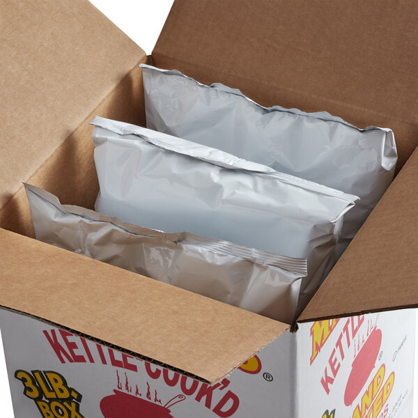 A Martin's box of Jalapeno Kettle Cook'd Potato Chips with a few packages inside.