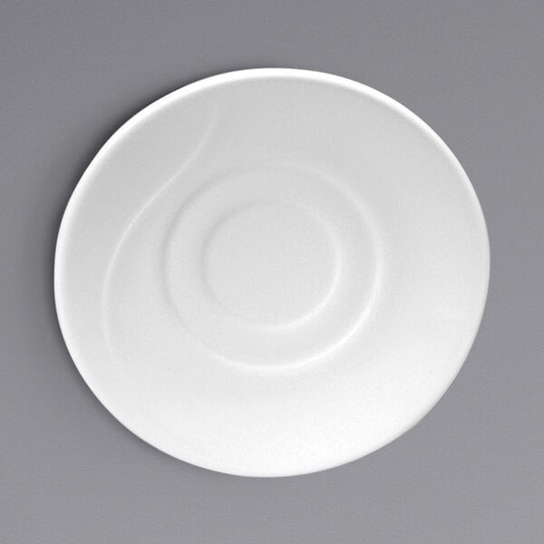 A white Oneida Eclipse embossed bone china saucer on a gray surface.