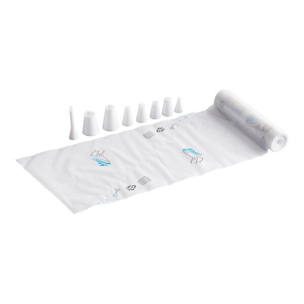 A roll of disposable piping bags is shown alongside several different plastic piping tips arranged in a row.