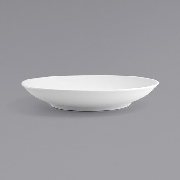 A white round porcelain low bowl with a spiral pattern.