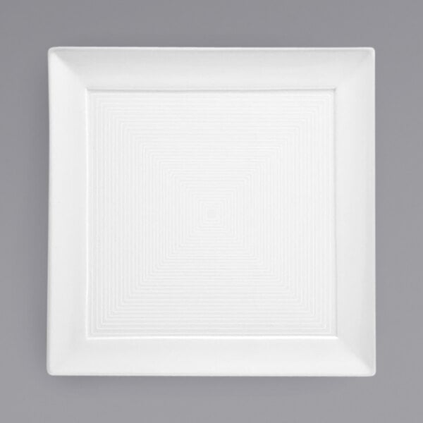 A white square porcelain plate with a square spiral pattern.