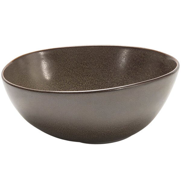 A close-up of a Front of the House Kiln mocha bowl with a white background and dark brown rim.