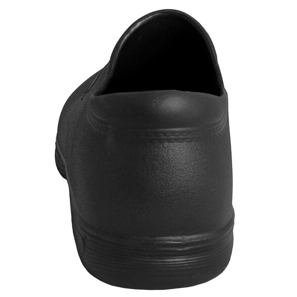 A close-up of a black Genuine Grip waterproof clog with a rubber sole.